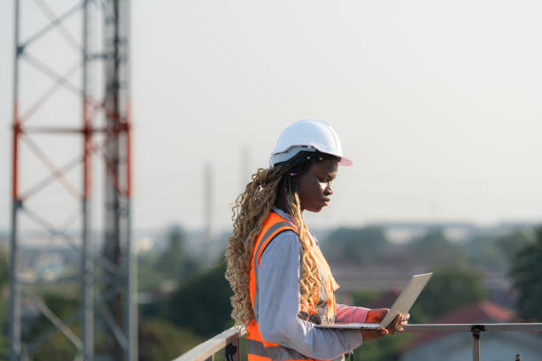 Engineer working on a building site The telephone and internet network signal systems of the construction building are being inspected.