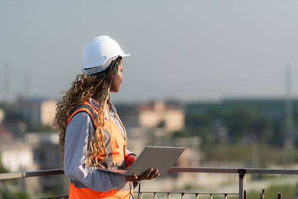 istock Engineer working on a building site The telephone and internet network signal systems of the construction building are being inspected. 1856737396