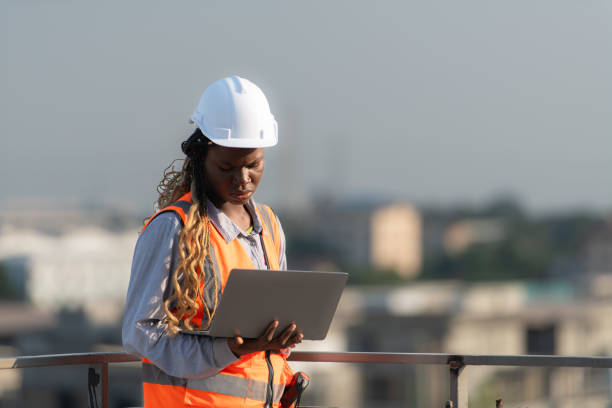 istock Engineer working on a building site The telephone and internet network signal systems of the construction building are being inspected. 1856740031
