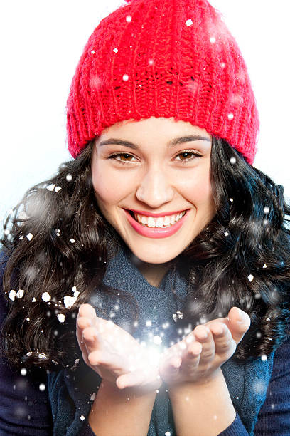 istock Christmas girl with snow in hands 185675406