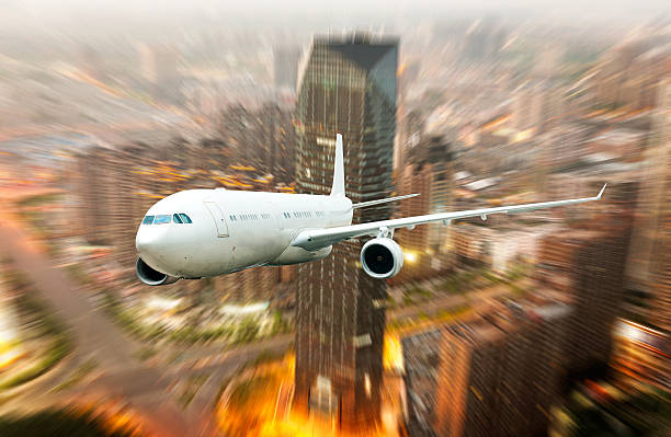 istock airplane away from the city 185675412