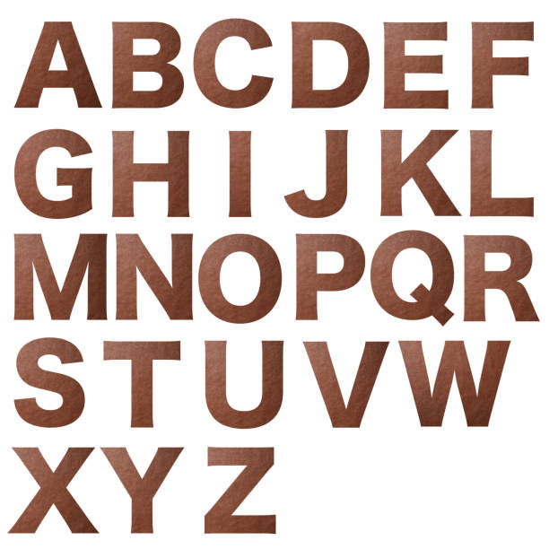 istock Isolated shot of brown leather alphabet on white background 1856758537