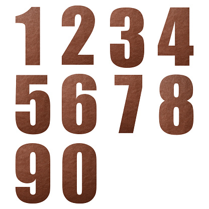 Close-up of brown leather numbers from 0 to 9 on white background.