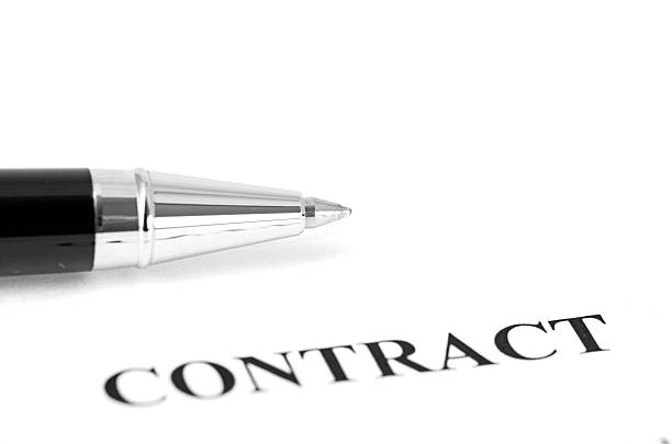 istock Close-up of silver pen on contract. 185679231