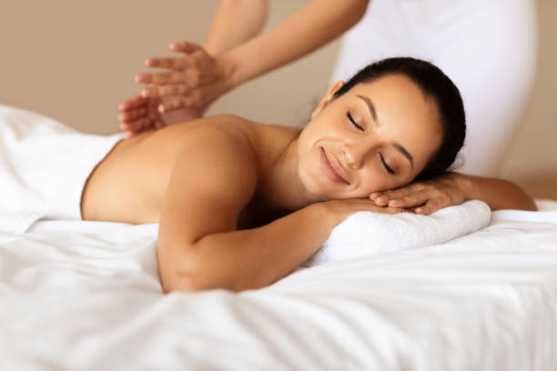 istock Young Lady Enjoying Back Massage In Luxury Beauty Salon 1856803207