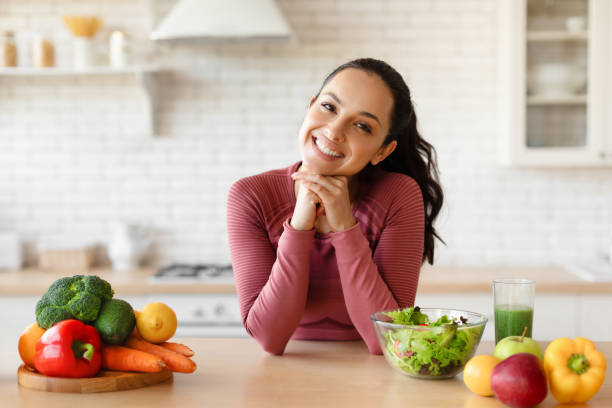 istock Nutrition Specialist Lady Posing At Kitchen Table With Vegetables Indoor 1856847841