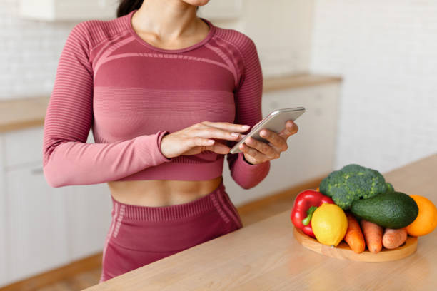 istock Sporty Lady Using Weight Loss Application On Smartphone Indoors, Cropped 1856848366
