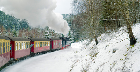 Historical steam train on the way to Brocken mountain in Harz area