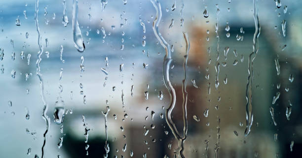 istock Close-up of raindrops on window 1856868503