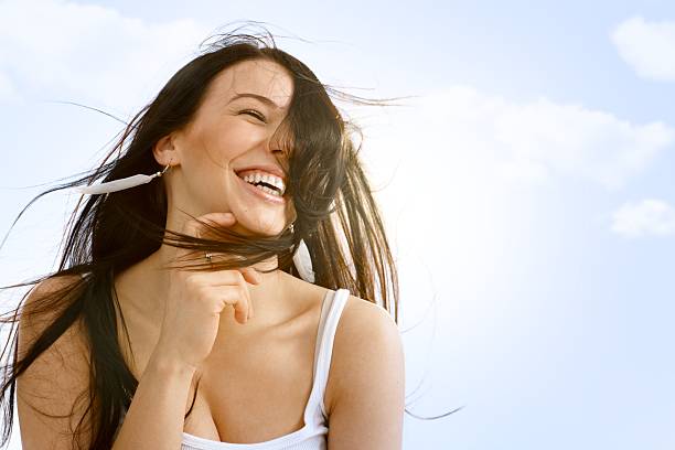istock Beautiful woman enjoying wind and summer 185689920