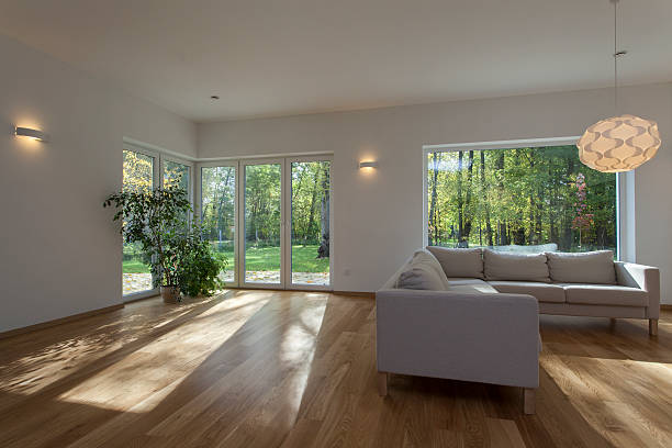 istock Large bright living room with large windows and wood floor  185689996