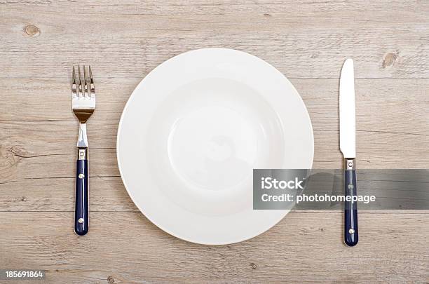 Blue Knife And Fork With White Plate Stock Photo - Download Image Now - Blue, Chrome, Dining Table