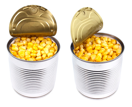 Canned corn in an opened tincan isolated over the white background