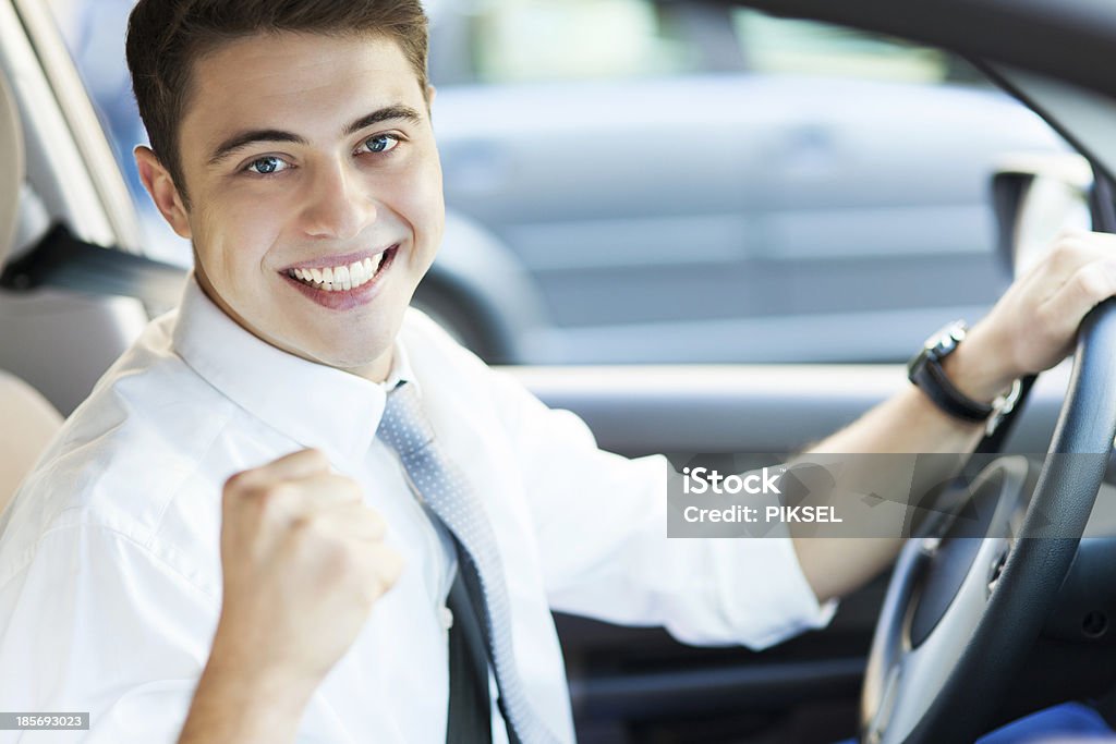 Excited man driving a car Driving Stock Photo