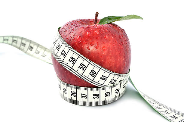 istock Apple and measuring tape - concept for weight loss 185693541