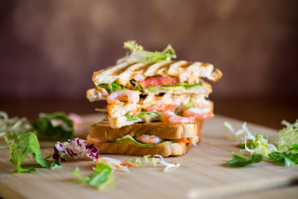 sandwich with lettuce and shrimp.