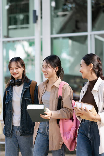 istock Group of Young Asian student walking and talking at university before class room. education, back to school concept 1856954159