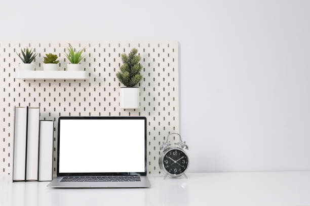 istock Laptop with blank white screen on office desk 1856963737