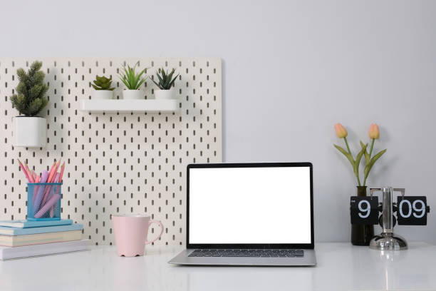 istock Laptop with blank white screen on office desk 1856965835