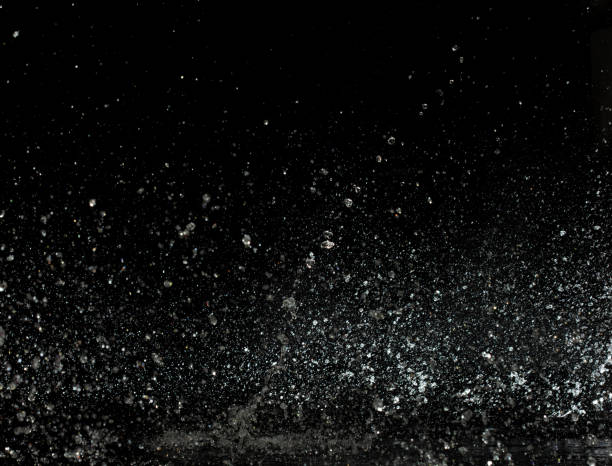 istock Throwing of Water splashes into drop water attack fluttering in wall floor and stop motion freeze shot. Splash Water for explosion texture graphic resource elements, black background isolated 1856969636
