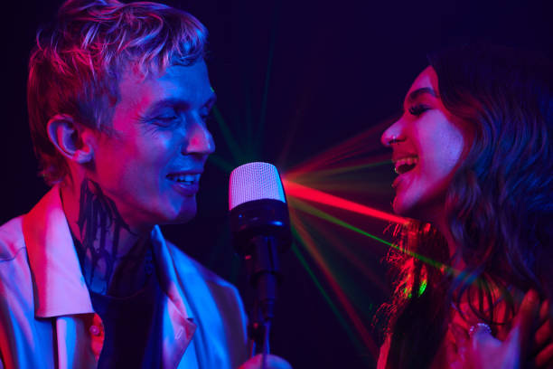 istock Couple Enjoying Singing in Karaoke 1856982137