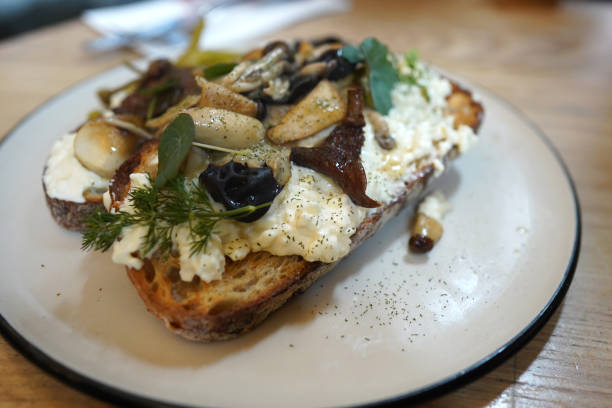 istock Mushroom cream cheese with rocket toast serving on white plate 1857042410
