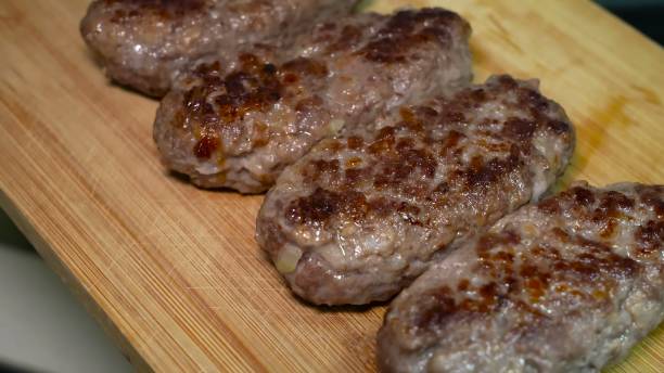 istock Preparing and serving lula kebab cutlets on bamboo skewers 1857044988