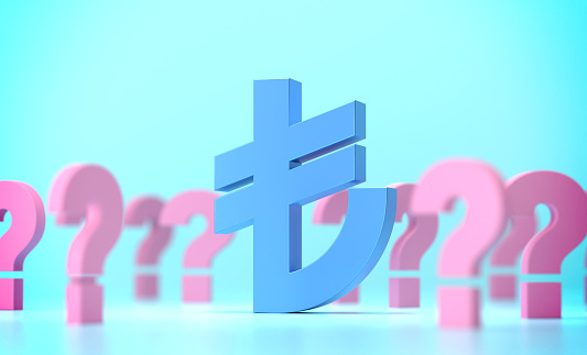 Turkish Lira Sign And Question Marks On Blue Background. Finance Concept.