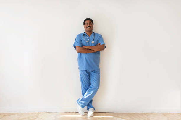 istock Smiling middle aged indian doctor man posing with folded arms 1857061647