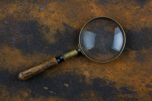 istock Vintage magnifying glass on metal rusty background, 1857064340