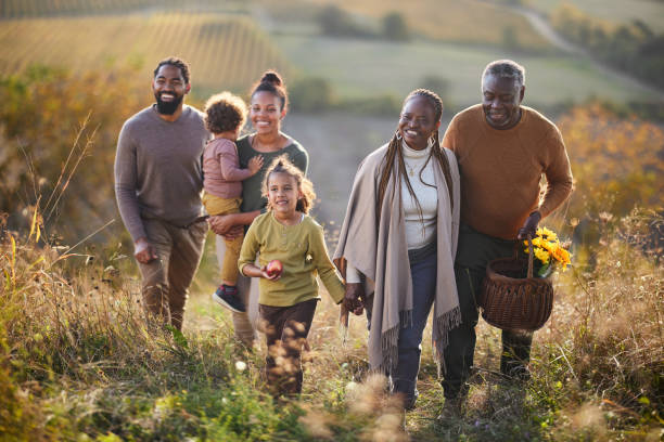 istock Happy black multi-generation family going on a picnic in autumn day. 1857070652