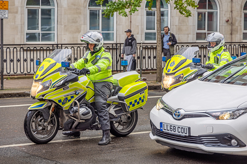 Woburn Place, London, England - November 1st 2023:  Police officers on motorbikes in the morning rush hour traffic