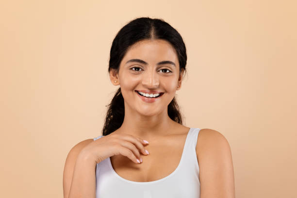 istock Young Beautiful Indian Female Model With Smooth Skin Posing Over Beige Background 1857108651