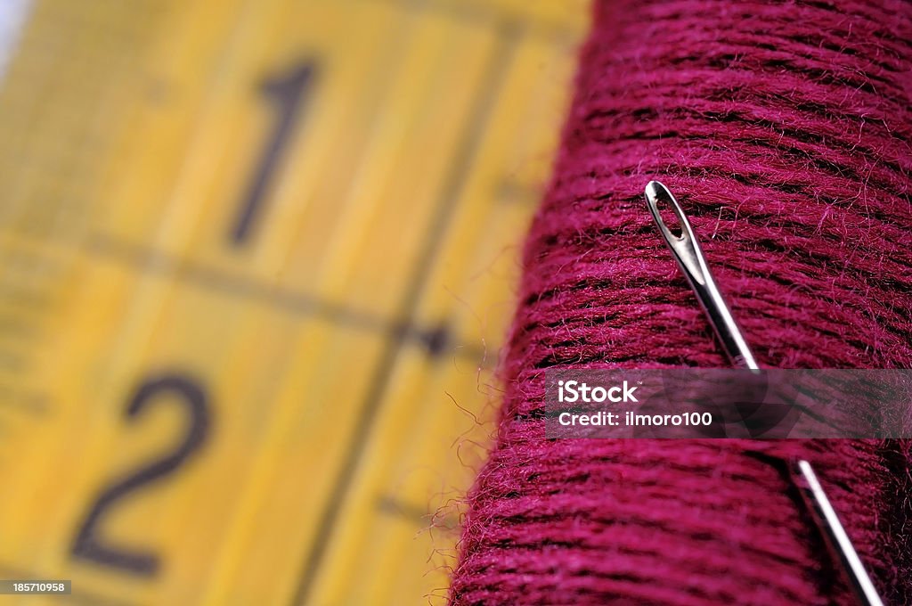red spool on measuring tape tailoring tools ready to use Centimeter Stock Photo