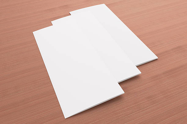istock Blank tri fold brochure on wooden background 185713215