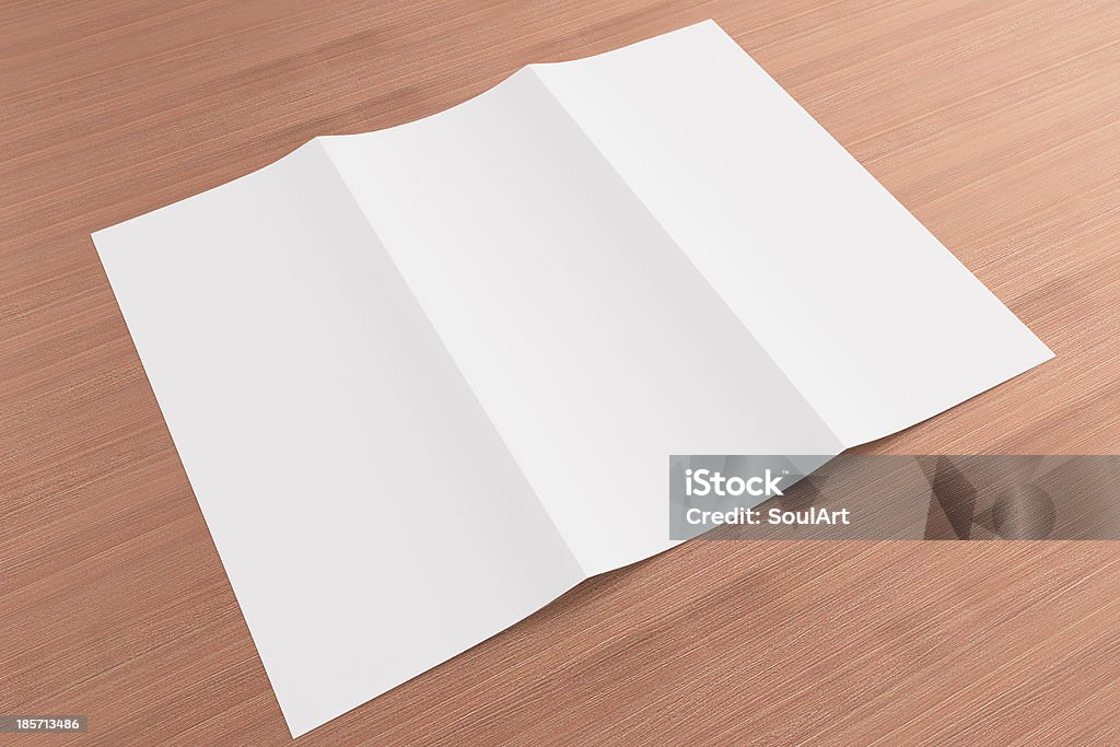 Blank tri fold brochure on wooden background Blank tri fold brochure on wooden background to replace your design or message Blank Stock Photo