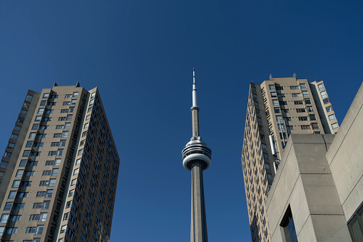 The CN Tower in Toronto, Ontario, Canada on a bright Autumn day with a cloudless sky.