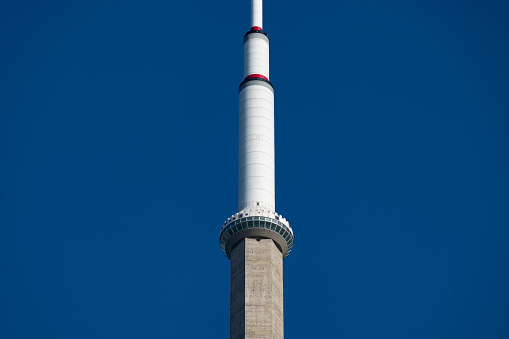 The CN Tower in Toronto, Ontario, Canada on a bright Autumn day with a cloudless sky.