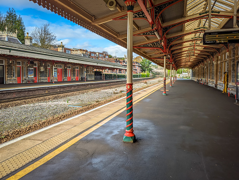 Preston, United Kingdom - May 14, 2019: Preston railway station In north west England with train at platform and passengers some motion blurred on adjacent platforms