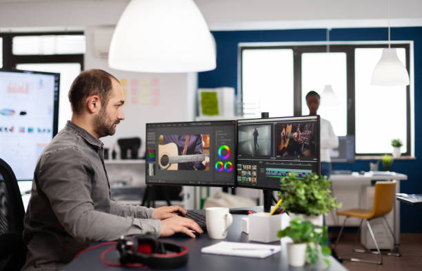 istock Video editor processing movie montage cutting footage and sound 1857175559