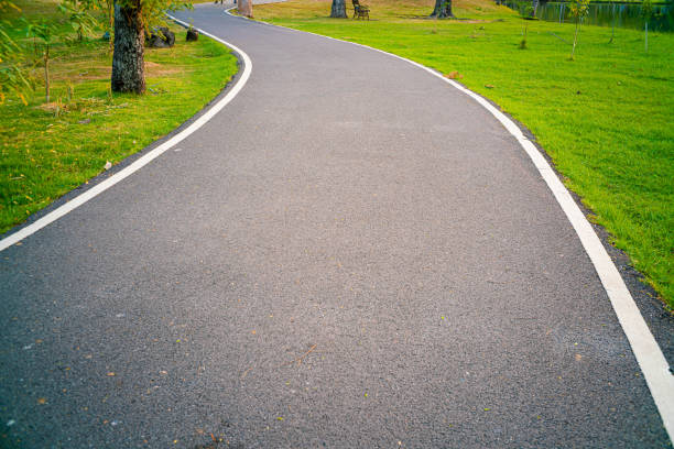 Walk and run pathway in city public park asphalt road