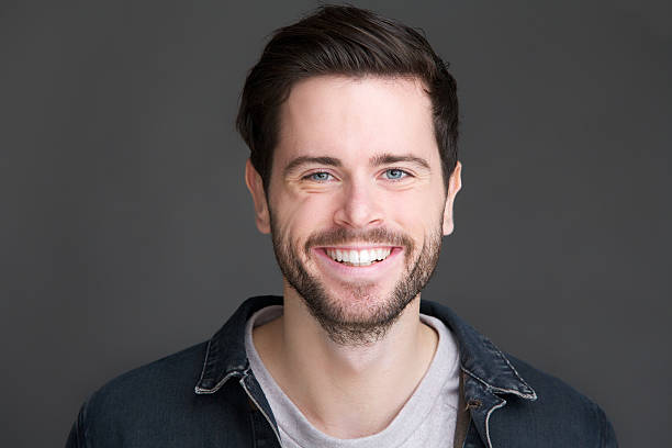 istock Portrait of a smiling young man looking at camera 185717660