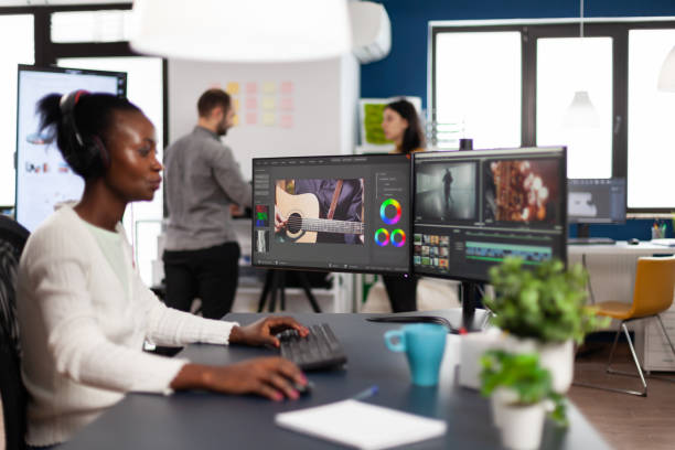 istock African videographer wearing headset editing movie 1857187648