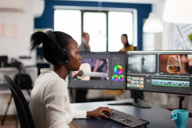 istock Black woman video editor developing new project film montage 1857192866