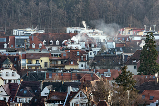 Roof landscape in Freiburg with smoking chimneys