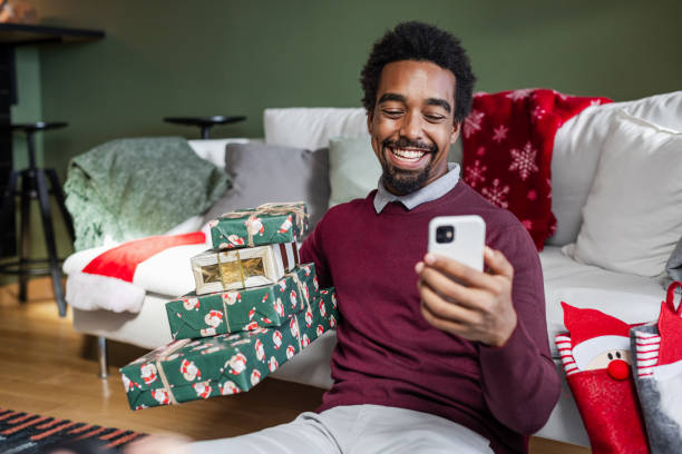 istock Young African American man talking on a video call during Holidays 1857198721