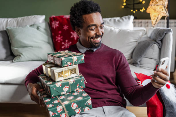 istock Young man talking on a video call during Christmas Holidays 1857199229