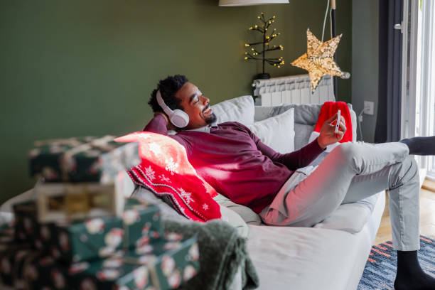 istock Young man relaxing at home during Christmas Holidays 1857199235