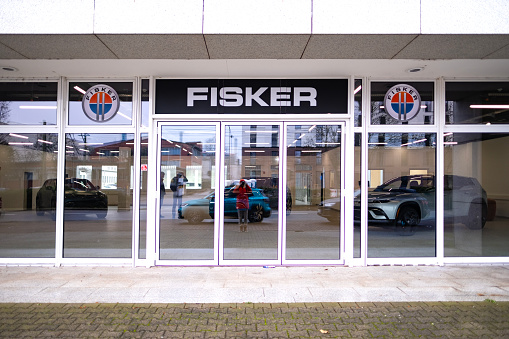 Advertising banners of Fisker, showroom Fisker Automotive Sales Office, emblem, concept Advertising and Marketing in Automotive Industry, American automobile manufacturer, Frankfurt - December 8, 2023