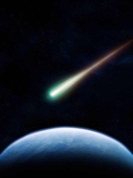 istock A comet in space against the background of the Earth. 1857215196